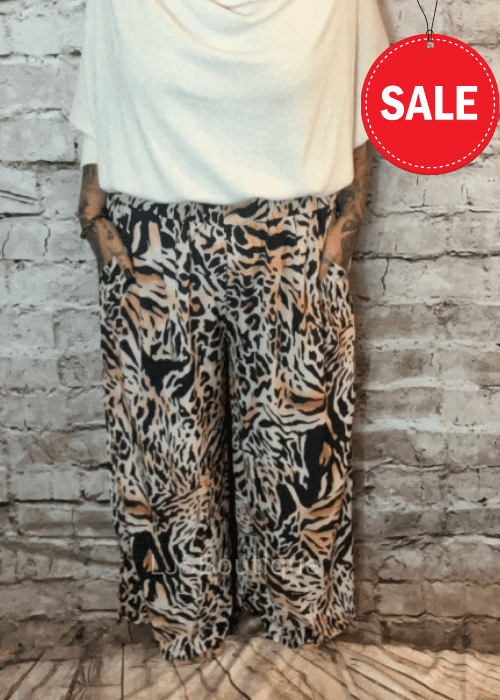 Rylie Animal print pants best fits 14-24 NO RETURNS ON SALE ITEMS