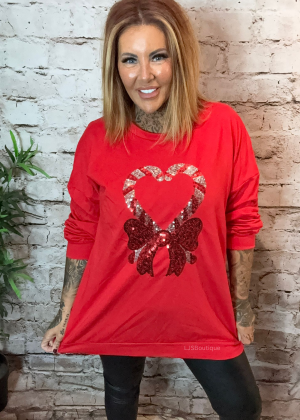 Candy cane sweater best fits 16-24